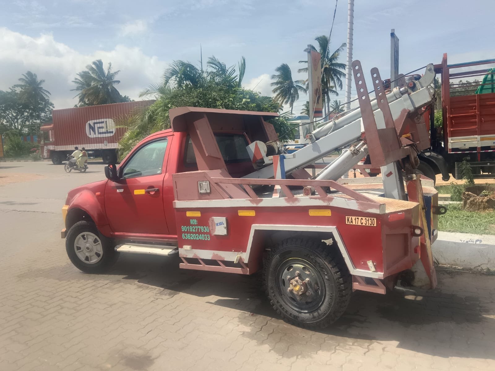 G.M.G hydraulic tow truck parked roadside