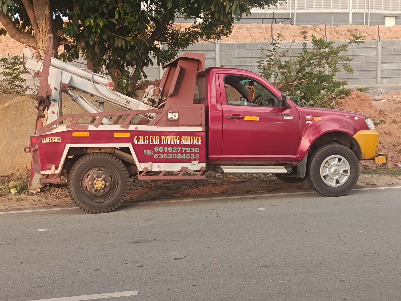 G.M.G tow truck parked roadside